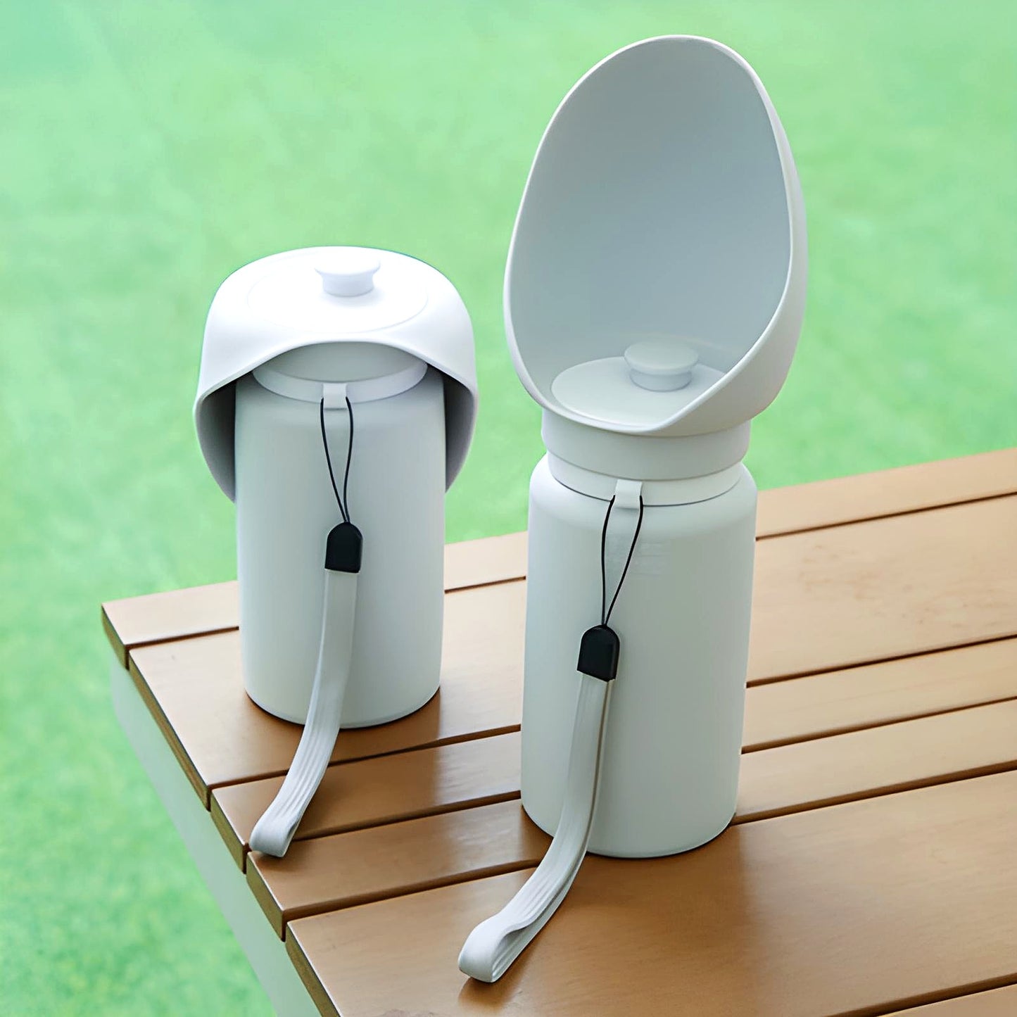 Sip-n-Stroll™ portable dog water bottles on a wooden bench – 550 ml travel design with leak-proof silicone cup